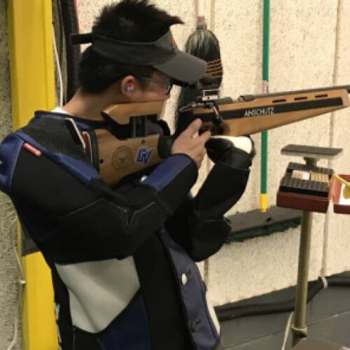 Rifle athlete, Christian Yap, prepares for competition shot during virtual competition.